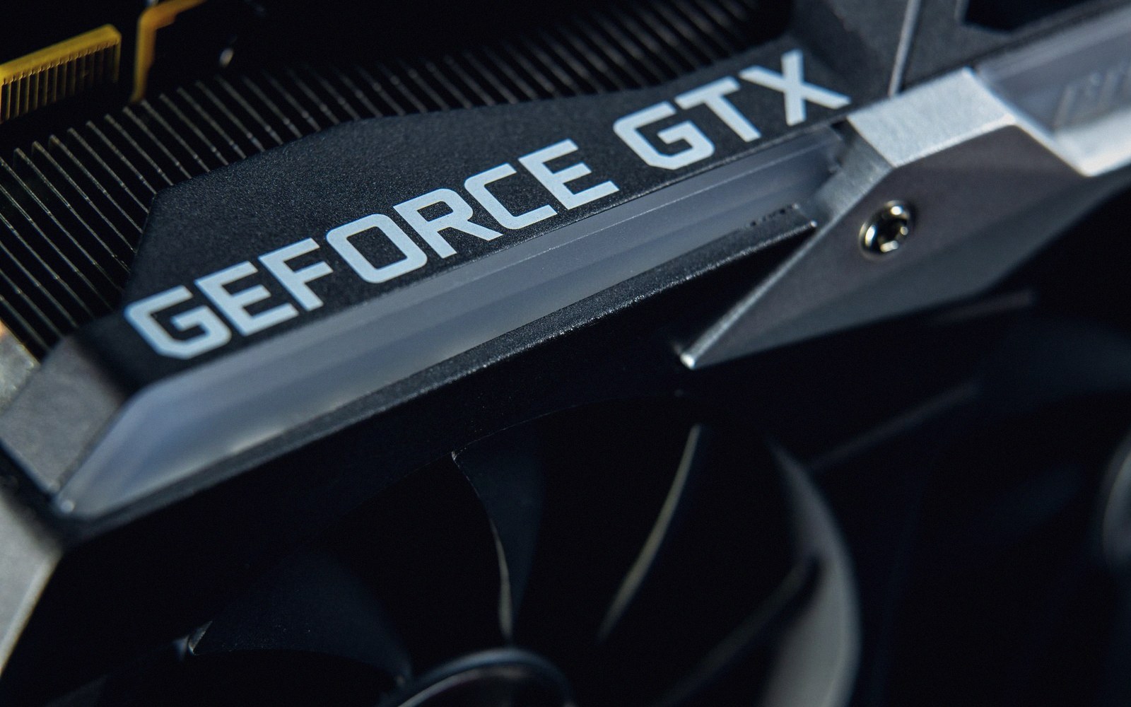 Close-up of a GeForce GTX graphics card showing its logo and cooling fan