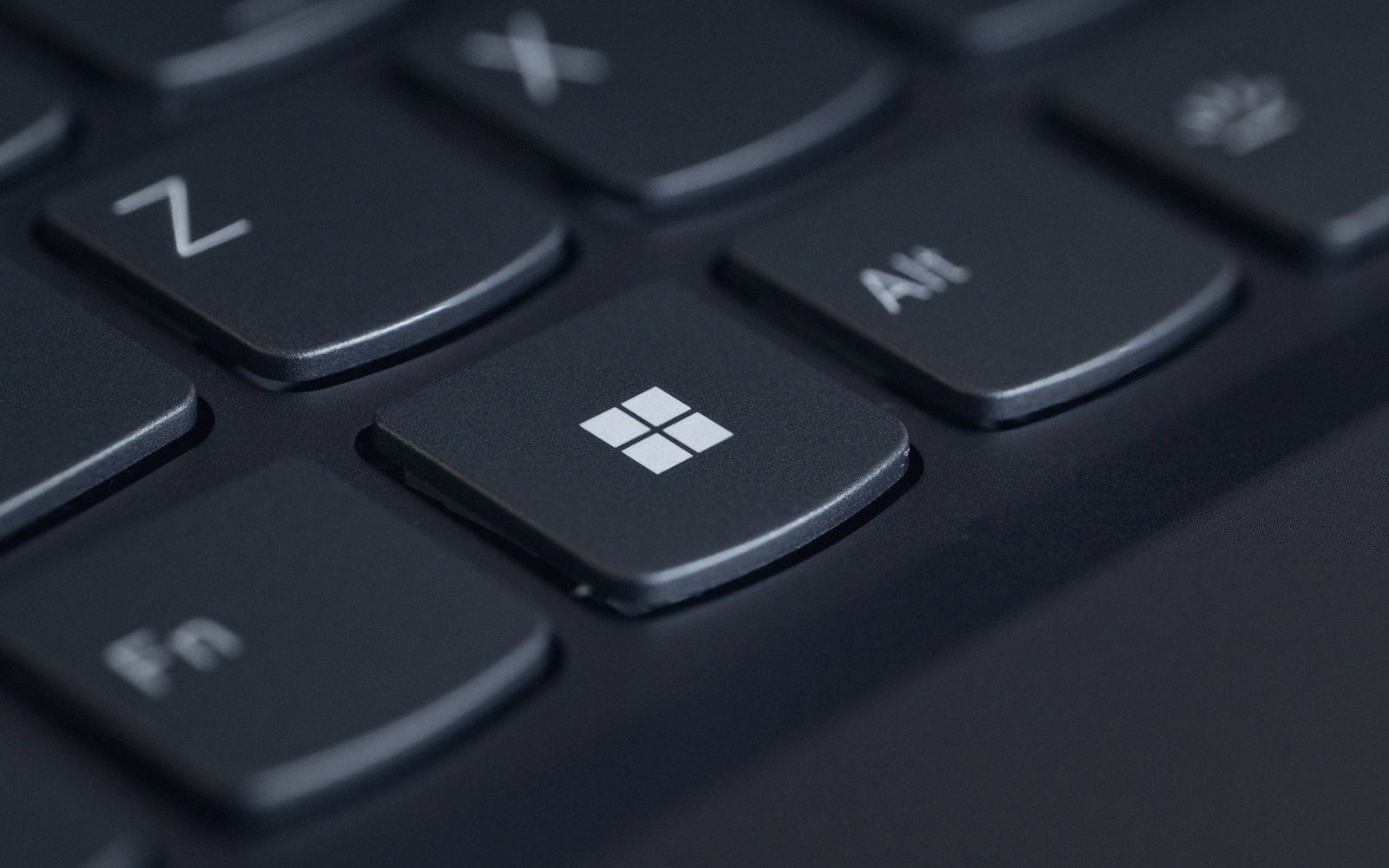 Close-up of the Windows key on a black laptop keyboard
